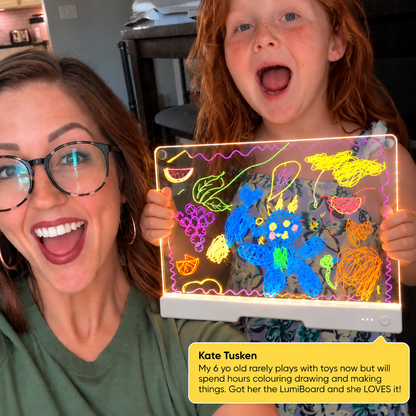 Girl holding GlowSketch V2 with positive customer feedback